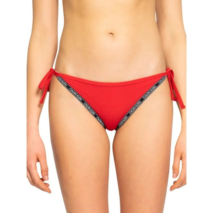 Woman in a red bikini with black and white stripe - Calvin Klein Underwear Beachwear