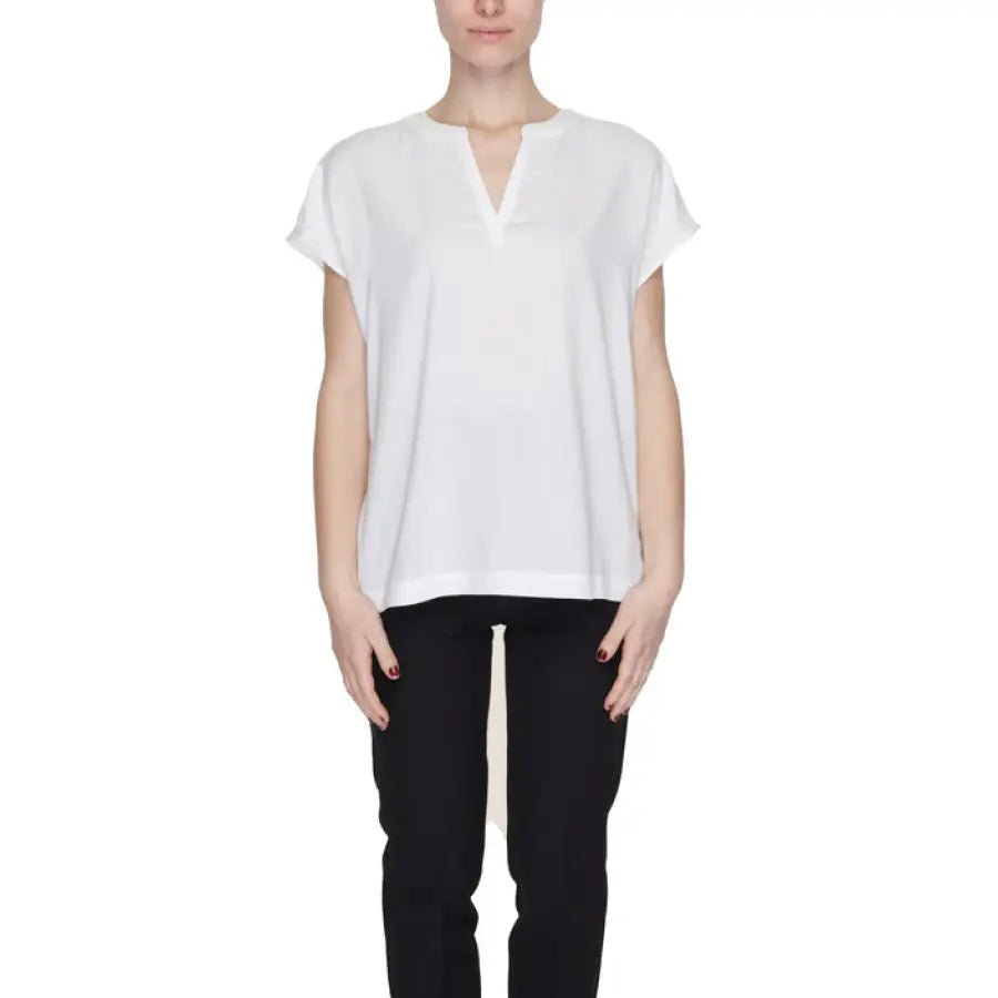Urban style clothing: Woman in white top and black pants - Street One Women’s Blouse