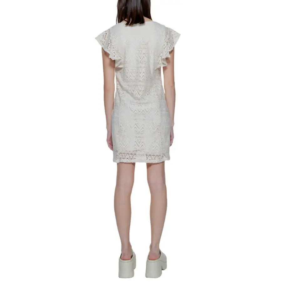 Back view of woman in white lace dress - Vero Moda urban attire by Vero Moda Women Dress