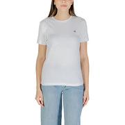 Woman wearing Calvin Klein Jeans White Short Sleeve Round Neck T Shirt with light blue jeans