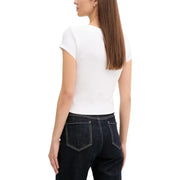 Woman wearing Calvin Klein Jeans white V neck short sleeve T shirt and dark blue jeans