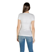 Woman wearing Guess White Cotton Elastane Round Neck Short Sleeve T Shirt and blue jeans