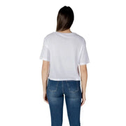 Woman wearing a white T shirt and blue jeans for Womens White T Shirt and Blue Jeans