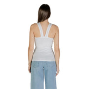 Woman modeling Calvin Klein Jeans white sleeveless round neck tank top with V-shaped shoulder straps and light blue wide-leg jeans