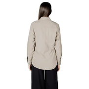 Woman wearing a beige button-down drawstring shirt from Womens Beige Button Down Drawstring Shirt collection