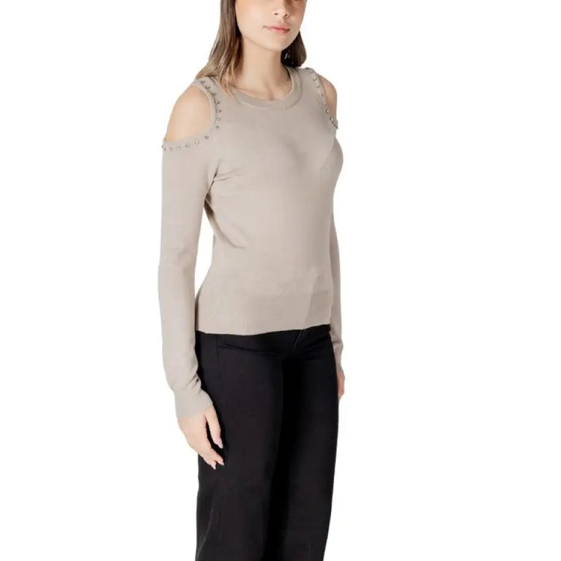 Woman wearing beige cold-shoulder sweater from Women Cold Shoulder Sweater Collection