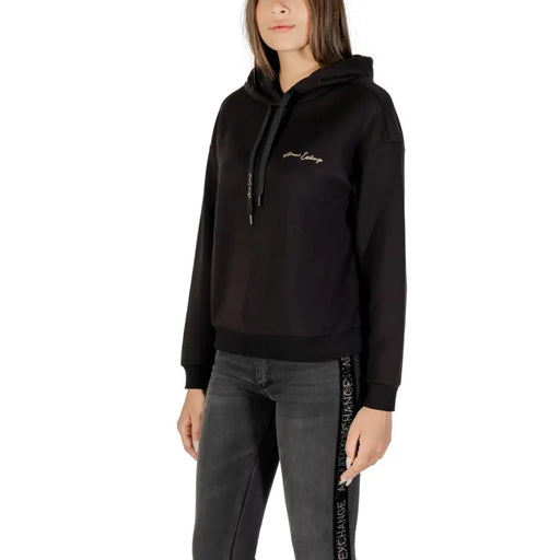Armani Exchange Women Black Printed Hooded Sweatshirt with white logo and dark grey jeans