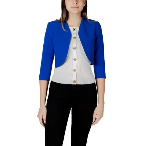 Woman wearing a blue bolero jacket from Morgan De Toi Women’s Black Cardigan collection