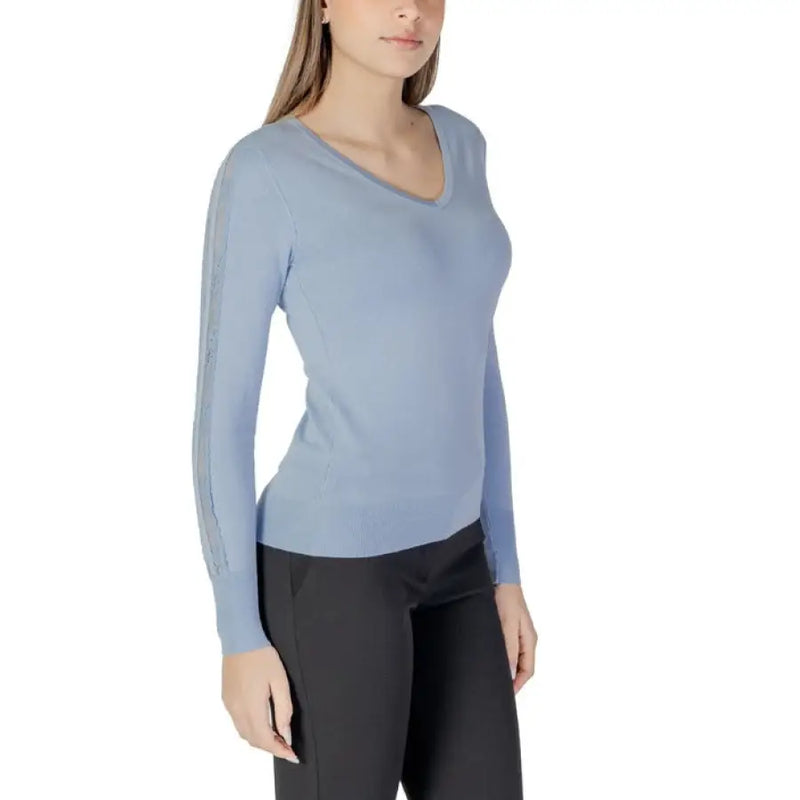 Light blue women’s V-neck sweater displayed on a model for the Womens Light Blue V Neck Sweater product