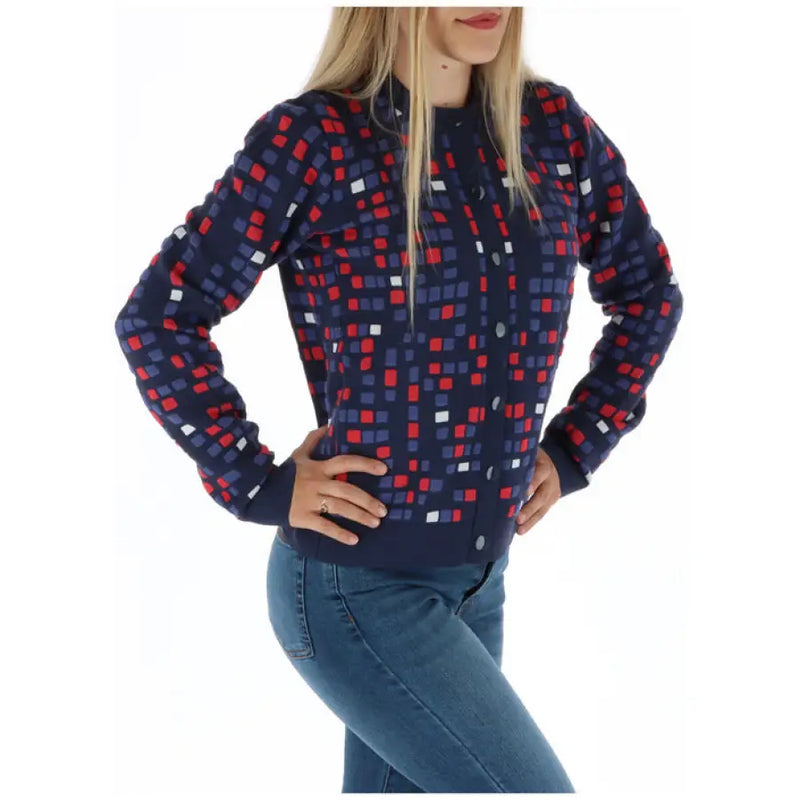 Woman wearing patterned button-down cardigan from Women Patterned Sweater Cardigan and Jeans Collection