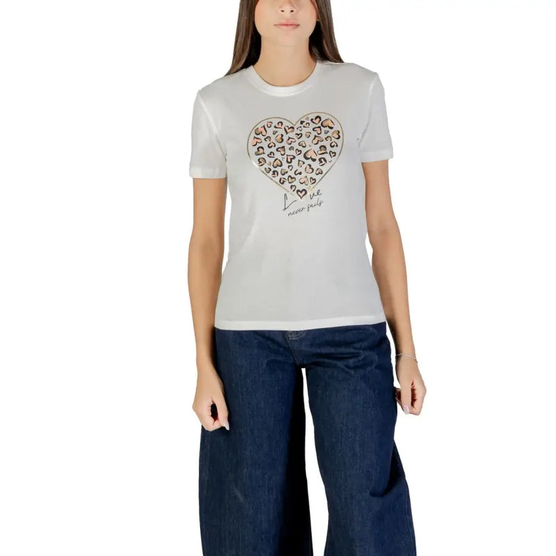 Woman wearing white organic cotton crew-neck T-shirt with heart-shaped leopard print design