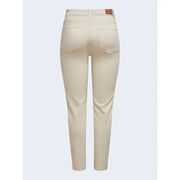 Women’s beige high-rise skinny jeans with classic denim texture and brown leather brand patch at the waistband back view
