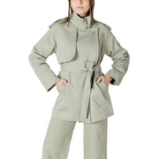 A sleek olive-green women’s belted trench coat blazer with structured shoulders and a fitted waist design