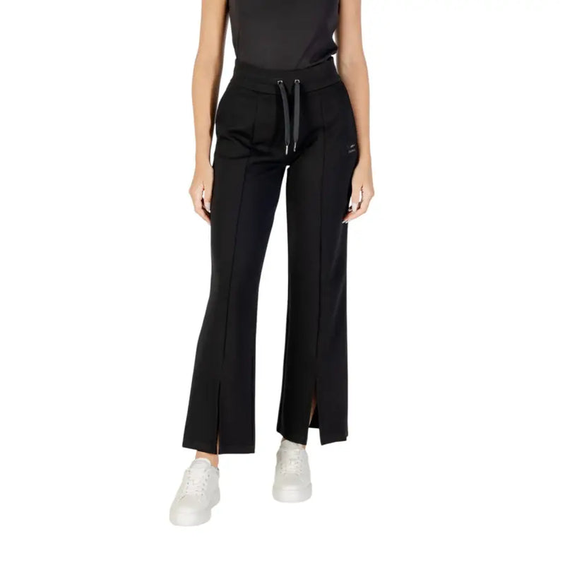 Women’s black flared sweatpants with drawstring waist and front slits from Armani Exchange