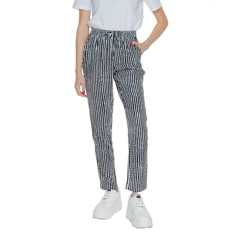 Women’s black geometric trousers with lace detail featuring high-waisted black and white houndstooth drawstring trousers