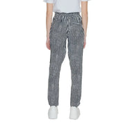 Women’s black geometric trousers with lace detail featuring black and white herringbone pattern and relaxed fit