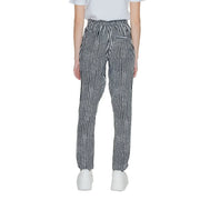 Women’s black geometric trousers with lace detail featuring black and white herringbone pattern and relaxed fit