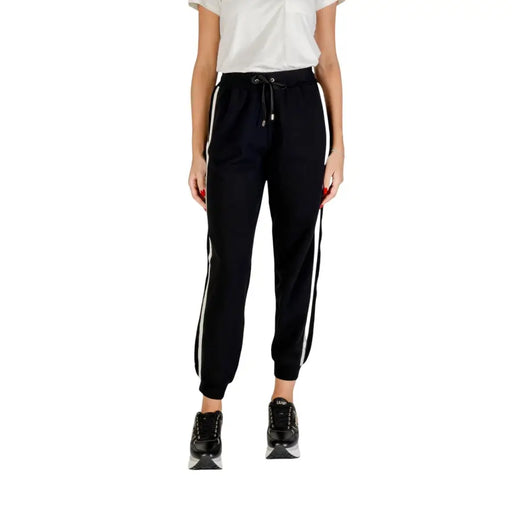 Women’s black cotton blend joggers with white side stripes and lace details