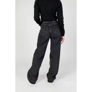 Women’s black wide leg denim jeans shown from the back with a faded wash and classic back pockets