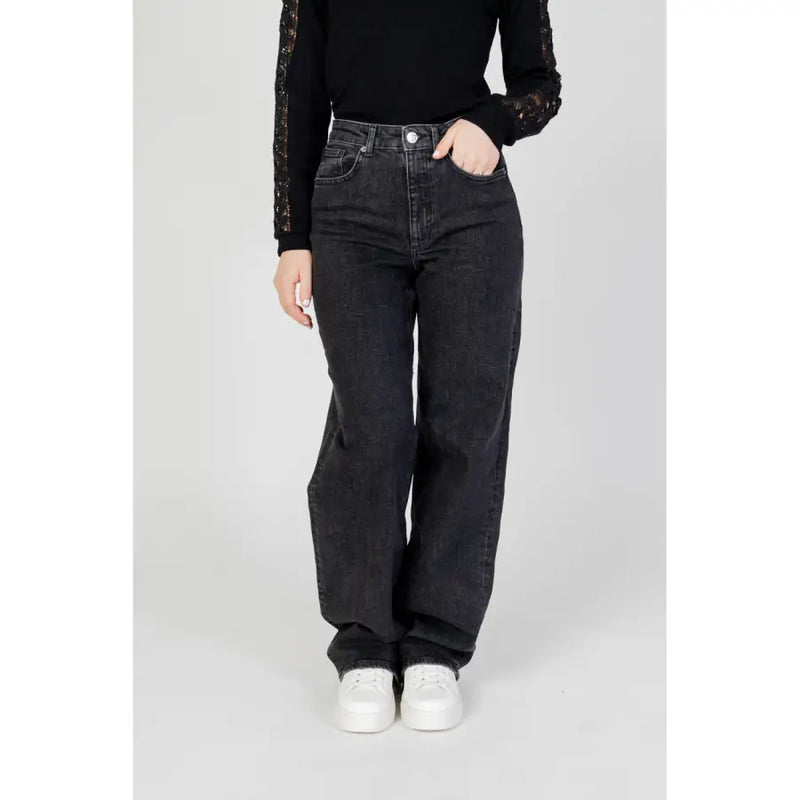 Women’s black wide leg jeans in high waisted black denim with a straight leg cut displayed from the front