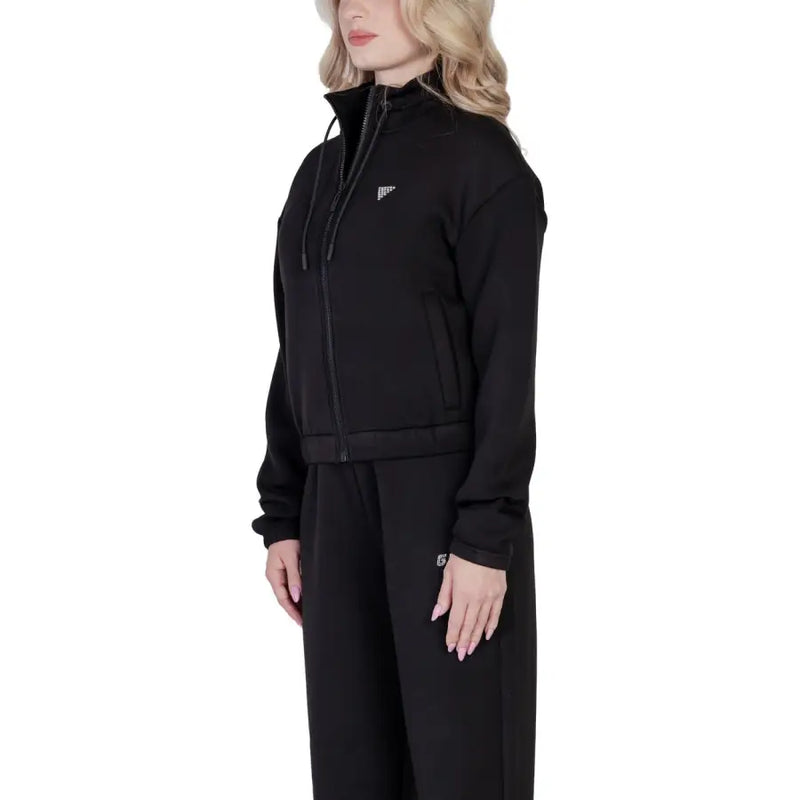 Women’s black zip-up hooded sweatshirt with matching sweatpants for active wear