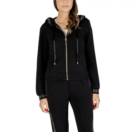 Women’s black zip-up hoodie and sweatpants with embellished rhinestone trim
