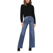 Women wearing black long-sleeved turtleneck and blue wide-leg jeans in fall winter style