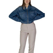 Women’s blue denim zip up blazer with two front pockets and zipper closure in cropped jacket style