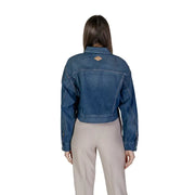 Back side of women’s denim zip up blazer showing blue denim cropped jacket with brown leather patch on back collar