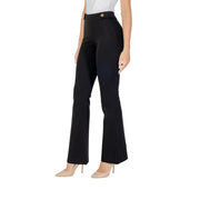 Women’s high-waisted black flare trousers with gold buttons from Guess for fall winter style