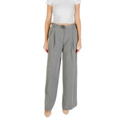 Women’s high-waisted wide-leg gray trousers with pleats and decorative belt buckle