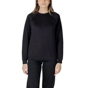Women’s light blue sweatshirt and black pants set displayed for casual wear