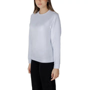 Women’s light blue crewneck sweatshirt in light gray with subtle embroidered logo on the chest in soft fabric