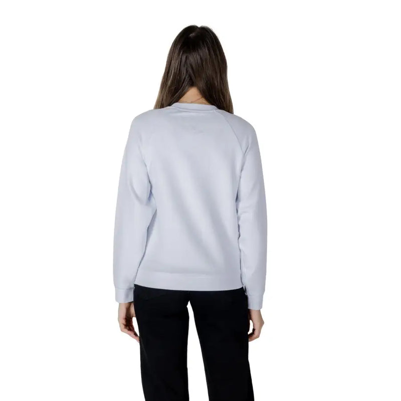 Women’s light blue sweatshirt in soft light gray fabric with long sleeves crew neck and ribbed cuffs