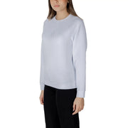 Women’s light blue crewneck sweatshirt in light gray with subtle embroidered logo on the chest in soft fabric