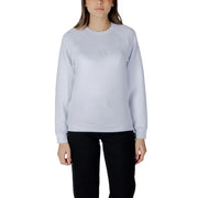 Women’s light blue crewneck sweatshirt with subtle embroidered logo on chest in light gray fabric