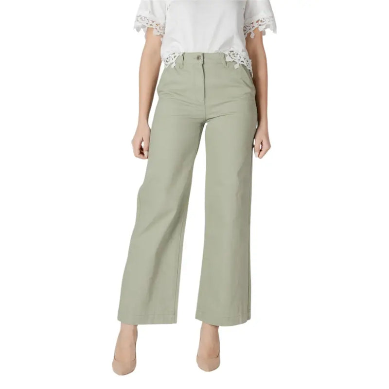 Women’s light green wide leg pants with a tailored fit and subtle front pleats in olive green fabric