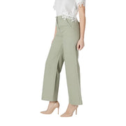 Women’s light green wide leg pants featuring sage green fabric with subtle pleats and lace trim at the waistband