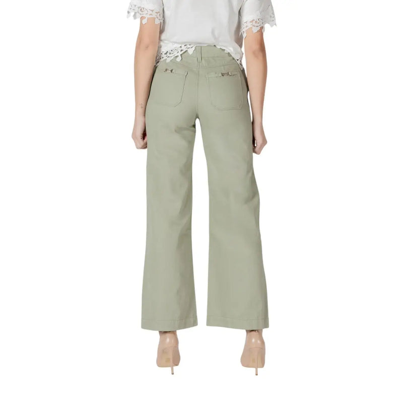 Women’s light green wide leg pants in olive with subtle texture and decorative metal accents on back pockets view