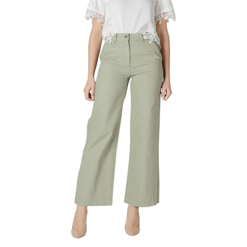 Women’s light green wide leg pants with a tailored fit and subtle front pleats in olive green fabric