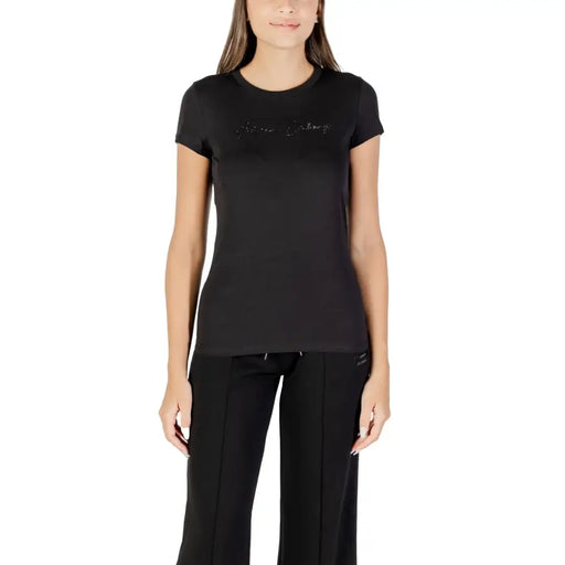Women wearing Armani Exchange short-sleeve black rhinestone cotton T-shirt with matching wide-leg sweatpants