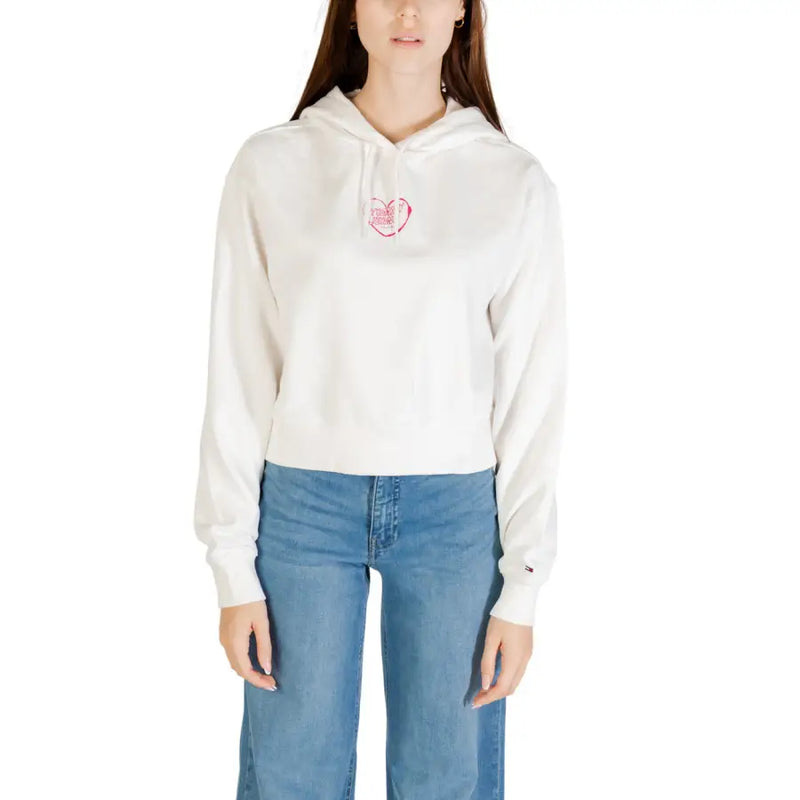 Women’s white cropped hoodie with pink heart graphic from Tommy Hilfiger Organic Cotton collection