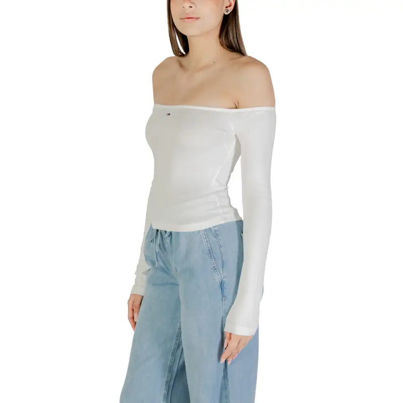 Womens white off the shoulder long sleeved top with a small logo on the chest made of lightweight fabric