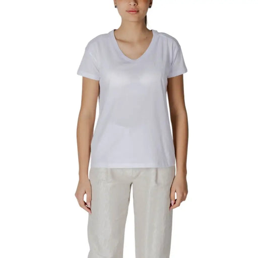 Womens white v neck short-sleeved cotton t shirt shown from the back side for casual wear