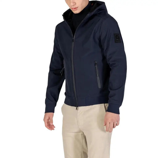 Navy blue zip-up hoodie with black accents and a patch on the left sleeve.